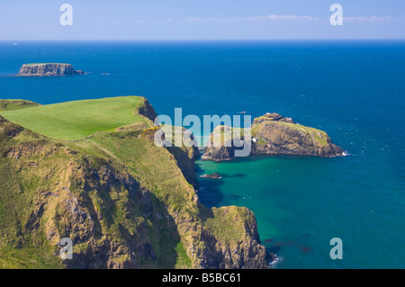 Carrick-a-rede rope bridge to Carrick Island, Larrybane Bay, Ballintoy, Ballycastle, County Antrim, Ulster, Northern Ireland Stock Photo