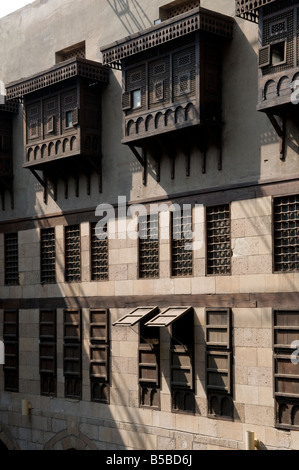 Egyptian style Mashrabiya oriel windows enclosed with carved wood latticework inside the Khanqah of Sultan Al-Ghuri Complex in old Cairo Egypt Stock Photo