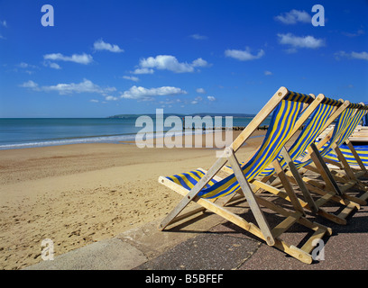 Deckchairs on the Promenade overlooking deserted beach, West Cliff, Bournemouth, Dorset, England, Europe Stock Photo