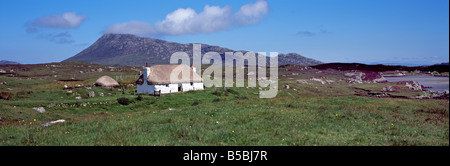Panoramic landscape Eaval hill and crofthouse Isle of North Uist 0uter Hebrides Western Isles Scotland UK Stock Photo