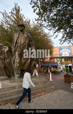 A woman walks in front of the statue of Vladimir Lenin in Seattle's Fremont Neighborhood. Stock Photo