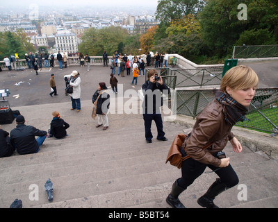 Tourists on the steps of Sacre Coeur Montmarte Paris Stock Photo