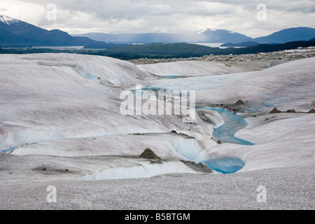 Melting ice carves streams into top of Mendenhall Glacier near Juneau, Alaska Stock Photo