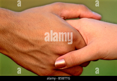 Man and woman shaking hands handshake Stock Photo