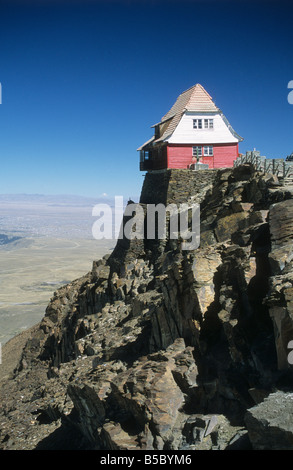 View of the old ski hut on Mt. Chacaltaya, altiplano in distance, Cordillera Real, near La Paz, Bolivia Stock Photo