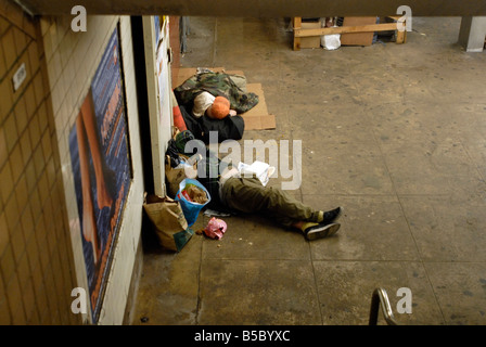 Homeless men camping out in the 23rd Street subway station in the New York neighborhood Chelsea Stock Photo