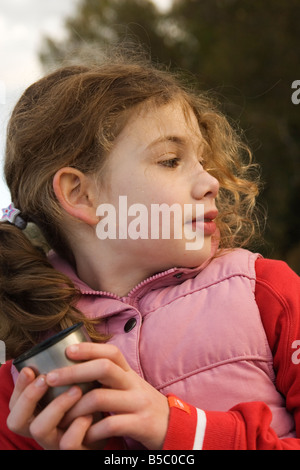 child drinking from flask Stock Photo