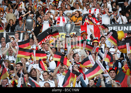 German supporters cheer their team prior to the start of a UEFA Euro 2008 group stage match against Austria. Stock Photo