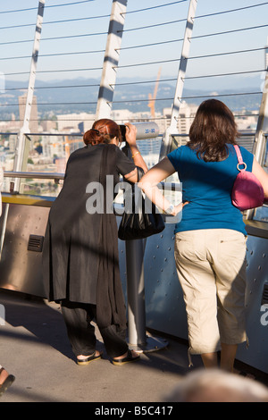 Tourist visitors on the observation deck of the Space Needle in Seattle, Washington, USA Stock Photo