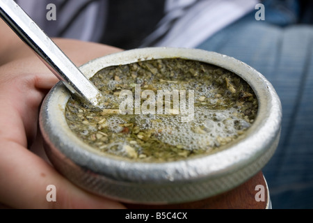 A young girl in Argentina prepares and drinks mate in the trendy neighbourhood of Recoleta, Buenos Aires, Argentina Stock Photo