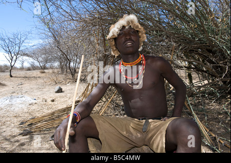 Member of the Hadza tribe at Lake Eyasi Tanzania preparing to go hunting Stock Photo