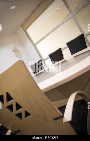 FOUR CHAIRS IN AN EMPTY BOARDROOM Stock Photo