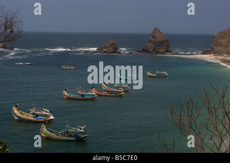 fishing boats anchored off a beach in southern java Stock Photo