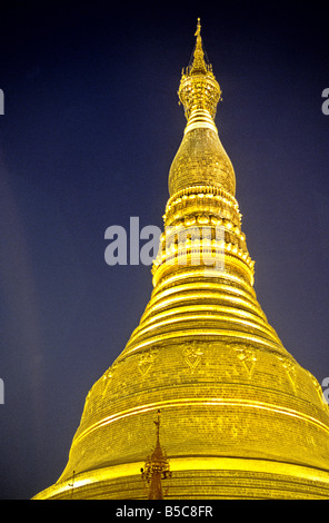 Gold encrusted spire of the Shwedagon Paya Pagoda rebuilt in the 18th century in the city of Yangon Burma Myanmar Stock Photo