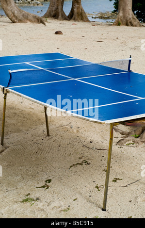 weathered table tennis table on sand, taken in Samoa Stock Photo