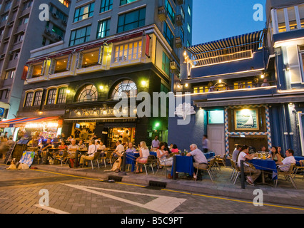 'Tourists and residents of Hong Kong at the popular alfresco waterfront bars and restaurants in Stanley Hong Kong Island' Stock Photo