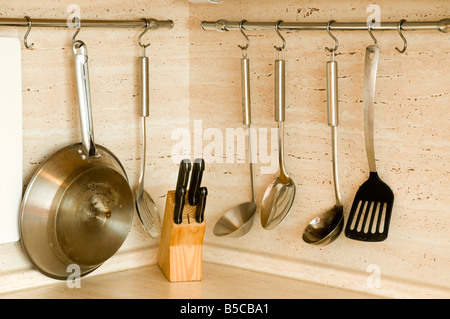 Kitchenware hanging on the wall Stock Photo