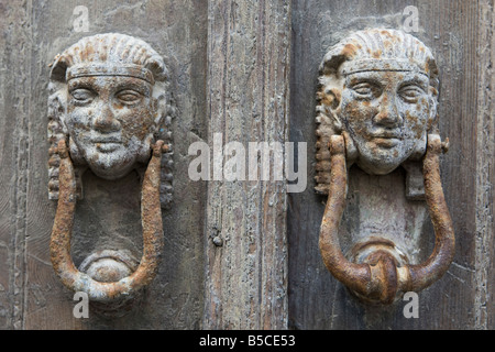 Pair of Old Traditional Door Knockers in the shape of  Female Heads, on Old Town House, Lindos, Island of Rhodes, Greece Stock Photo