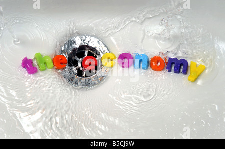 'THE ECONOMY' WASHED DOWN THE PLUGHOLE..... Stock Photo
