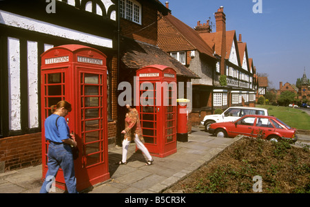UK England Wirral two k6 phone boxes outside Port Sunlight post office Stock Photo