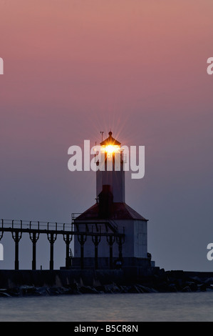 Sunset and Michigan City East Pierhead Lighthouse on Lake Michigan Michigan City Indiana Stock Photo