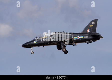 British Aerospace Hawk T1 military jet trainer plane of the Royal Air Force flying on approach with wheels down. Side view. Stock Photo