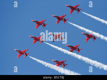 The Royal Air Force Red Arrows aerobatic team displaying skill, teamwork and discipline while flying in formation Stock Photo