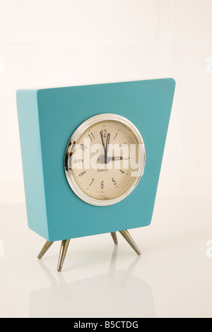 Close up of aqua retro clock isolated on white background Stock Photo