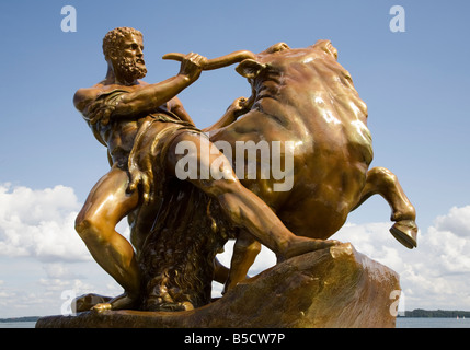 Bronze statue of Hercules wrestling a bull in the grounds of Schwerin ...