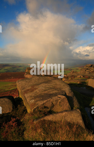 Rainbow and rain cloud on Stanage Edge Hathersage Derbyshire England UK Stock Photo