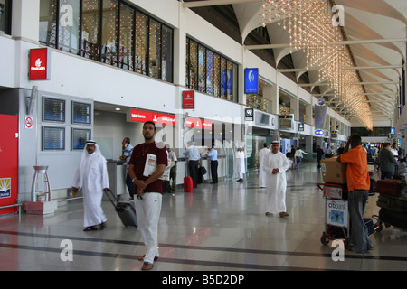 Passengers checking in at Dubai International Airport UAE Stock Photo