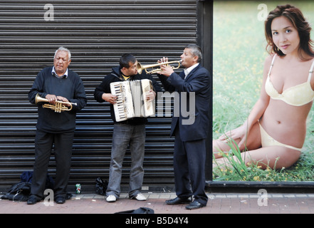 The band are Romanian Gypsies The Advertisement is for Marks and Spencers The model is Myleen Klass Grafton St Dublin Ireland Stock Photo