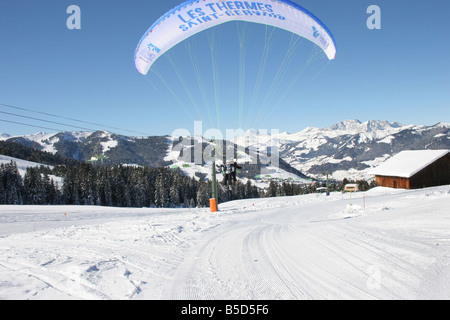 Parapente with skiers in blue sunny sky near Mt blanc. St Gervais Haute Savoie France. Horizontal.  50431 Montblanc-Ski2005 Stock Photo