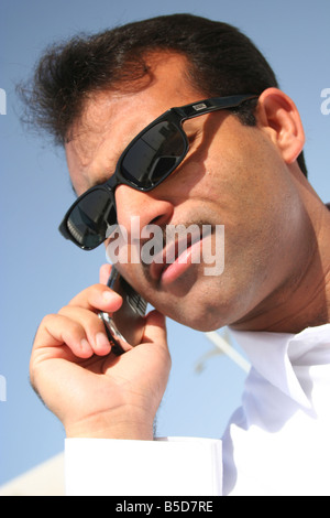 arab businessman talking on a mobile phone in dubai the united arab emirates Stock Photo