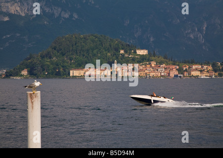 TOURIST SPORT BOAT ON LAKE COMO BELLAGIO IN BACKGROUND ITALY EUROPE Stock Photo