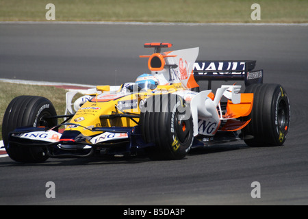 Renault Formula One driver Fernando Alonso from Spain, left, speeds ...
