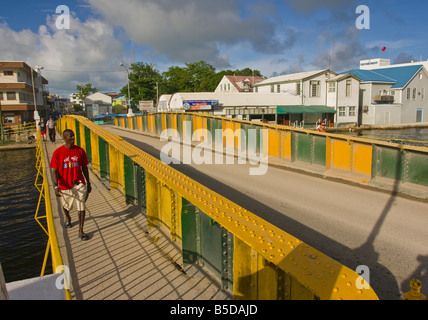 BELIZE CITY BELIZE People on the Swing Bridge which crosses Haulover Creek in downtown Belize City Stock Photo