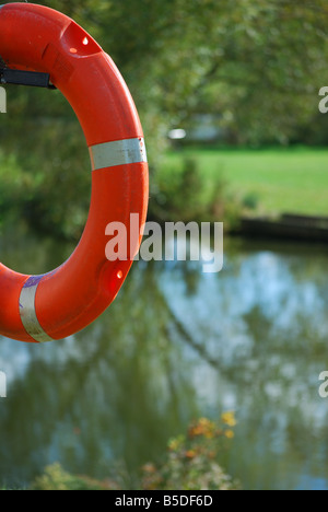 life ring on side of lake Stock Photo