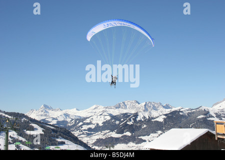 Parapente with skiers in blue sunny sky near Mt blanc. St Gervais Haute Savoie France. Horizontal.  50428 Montblanc-Ski2005 Stock Photo