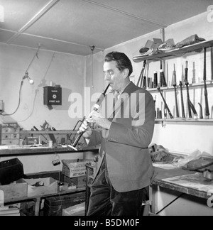 Bagpipe maker Mr. George Alexander seen here in his workshop. Circa 1960 Stock Photo