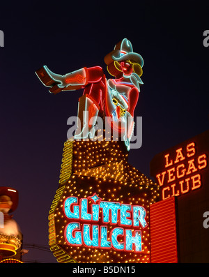 Close-up of neon sign of a cowgirl advertising Glitter Gulch at night in Las Vegas, Nevada, USA Stock Photo