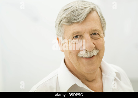 Senior man smiling at camera, portrait Stock Photo