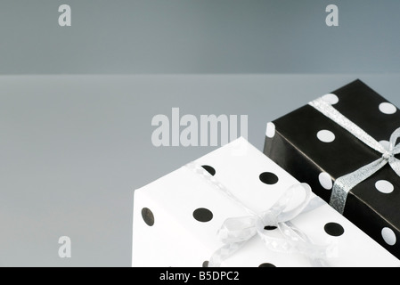 Two black and white polka dotted gift wrapped presents Stock Photo