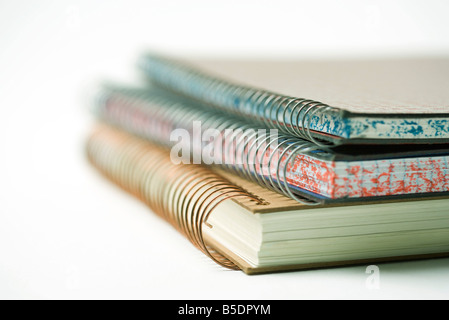 Stacked spiral notebooks, close-up Stock Photo