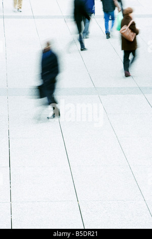 Pedestrians crossing public square Stock Photo