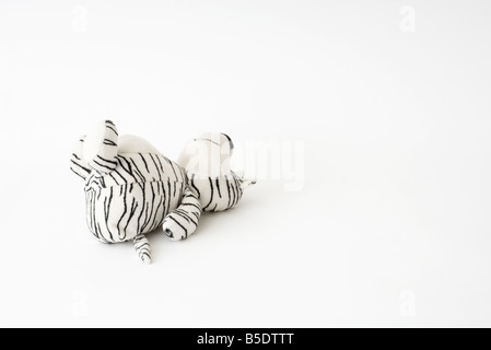 Stuffed tiger lying on its back