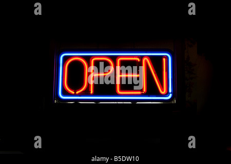 A neon OPEN sign commonly seen in businesses Stock Photo