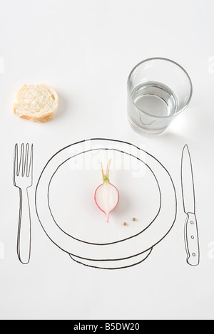 Place setting with half a radish and a small piece of bread Stock Photo