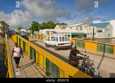 BELIZE CITY BELIZE People and vehicles on the Swing Bridge which crosses Haulover Creek in downtown Belize City Stock Photo