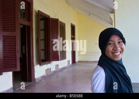 Young Indonesian Girl in Fort Rotterdam in Makassar on Sulawesi in Indonesia Stock Photo
